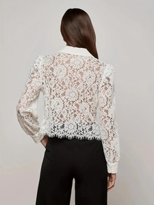 Back view of a white floral lace long sleeve shirt with scalloped eyelash lace hem