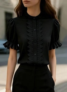Close-up of black lace patchwork and puff sleeves on the elegant stand collar shirt
