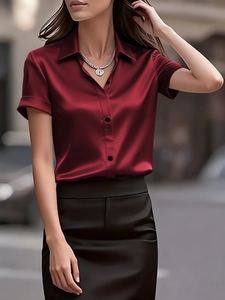 Detail of burgundy satin short sleeve shirt with premium silk gloss and black buttons