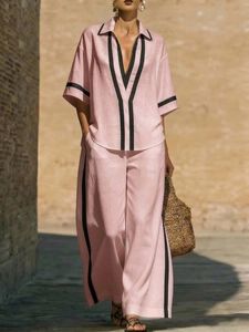 Women's two-piece linen set with short-sleeved shirt and wide-leg trousers in dusty rose
