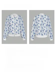 Detail of blue floral print jacket with zipper and white ribbed collar and cuffs