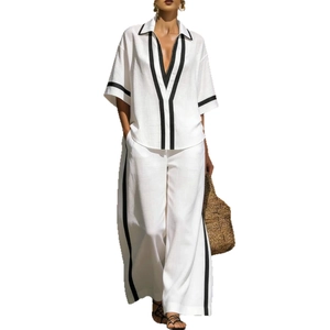 Women's 2-piece white leisure set with V-neck short sleeve shirt and wide-leg pants