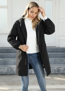 Detail of a black longline hooded windbreaker jacket with zipper and large pockets