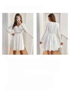 Close-up of white lace dress featuring V-neckline and intricate hollow-out waist details