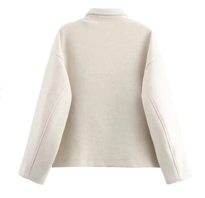 Detailed back view of a minimalist cream white lapel jacket featuring drop shoulders