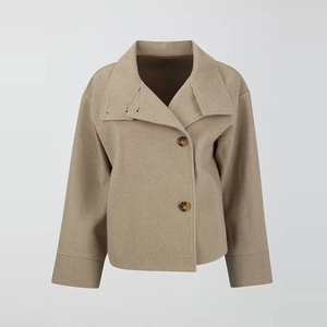 Close-up detail of oversized collar and tortoiseshell buttons on wool blend coat