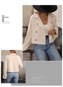 Detail of off-white short wool jacket with double-breasted buttons and large lapel collar