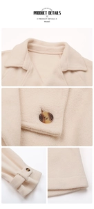 Macro detail of cream polar fleece jacket featuring amber buttons and sleeve cuff straps