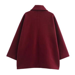 Rear view of a burgundy oversized wool jacket with classic lapel and clean stitching details