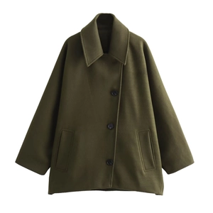 Detail view of wide notched lapel and button closure on dark green wool jacket