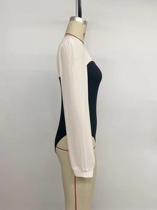 Detailed side view of slim fit black bodysuit with contrast white sheer long sleeves