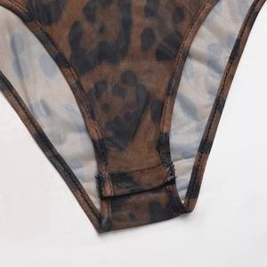 Detail shot of leopard print mesh bodysuit with snap button closure at the crotch