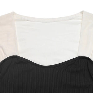 Detail of square neck bodysuit with white mesh patchwork and black ribbed knit texture