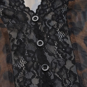 Detail of leopard print mesh bodysuit with black floral lace trim and front buttons