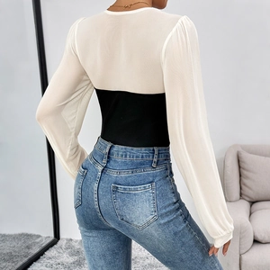 Elegant patchwork bodysuit with white mesh long sleeves and a slim black contrast bodice