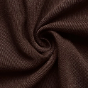 Macro shot of dark brown fabric showing detailed plain weave texture and soft pleats