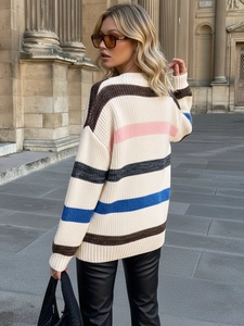 Women's oversized striped knit sweater featuring vibrant color blocks and a relaxed fit