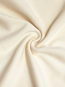 Close-up of premium cream white ribbed knit fabric texture with soft vertical stripes