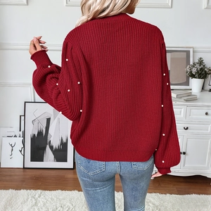 Elegant red knit V-neck cardigan with pearl embellished lantern sleeves and ribbed texture