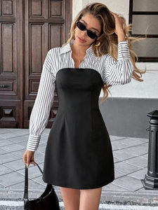 Detail shot of elegant faux two-piece dress with striped lapel collar and waist cut