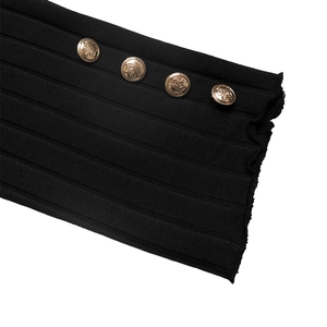 Detail of black ribbed knit fabric featuring vintage gold crown embossed buttons
