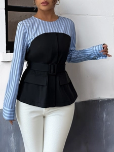 Detail of striped long sleeve shirt with a black peplum vest and square buckle belt