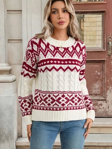 Close-up of Fair Isle jacquard pattern and cable knit texture on women's vintage sweater