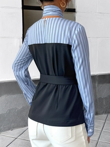 Rear view of striped patchwork shirt with black contrast panel and waist belt detail