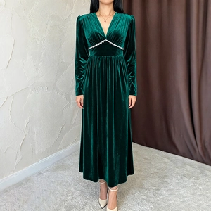 Elegant emerald green velvet long sleeve V-neck maxi dress with white zigzag detail
