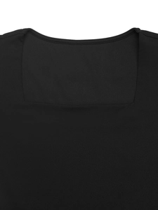 Detailed close-up showing the square neckline and high-quality stitching of the black dress