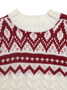 Detail of red and white Fair Isle knit sweater with rib neck and cable texture