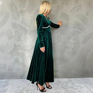 Elegant emerald green velvet long sleeve V-neck dress with white lace waist detail