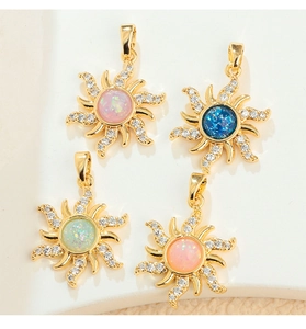 Detailed view of bohemian sun pendants with colorful opal-style stones and zircons