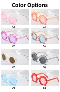 Collection of eight colorful shell-shaped children's sunglasses with glitter resin frames