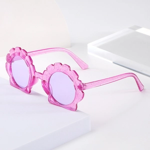 Kids shell shaped pink glitter sunglasses with translucent purple lenses for trendy toddlers