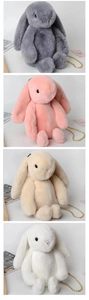 Detail view of four colors of plush rabbit bags with elegant gold chain straps