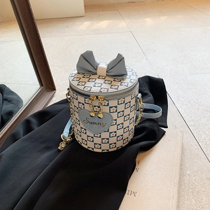 Blue and white checkered bucket bag with flower patterns and blue bow detail
