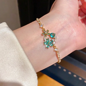 18k gold plated flower and heart charm bracelet with green gemstones and zircons