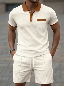 Detail of waffle knit fabric on men's polo set with contrast collar and chest pocket