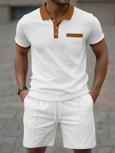 Detail of waffle knit fabric on men's white polo shirt and drawstring shorts set