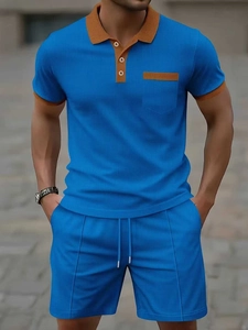 Men's blue waffle knit two-piece leisure set with yellow contrast collar and pocket details