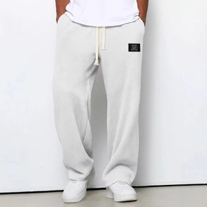 Men's loose waffle knit trousers in light grey with comfortable drawstring waist