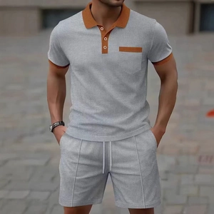 Grey waffle knit polo and shorts set with orange contrast trim for men's summer casual wear