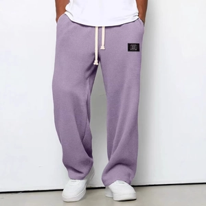 Men's purple waffle knit pants featuring loose straight cut and drawstring waist