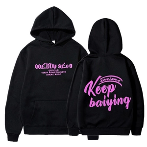 Close-up of black hoodie showing pink Keep lettering and drawstring hood details