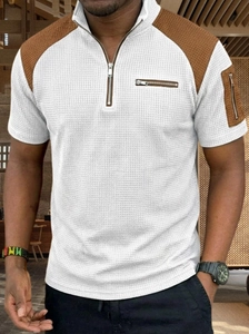 Detail of waffle knit fabric and brown patchwork on this men's quarter-zip polo shirt
