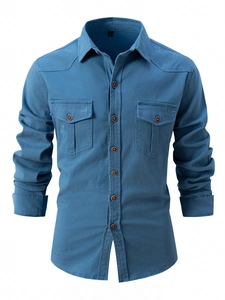 Detail of dark blue cotton shirt with double chest pockets and brown buttons