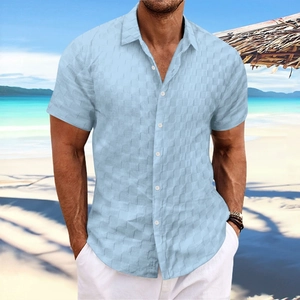 Detail of light blue textured jacquard checkered pattern on men's short sleeve shirt