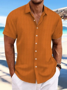 Men's burnt orange linen striped short sleeve shirt in a casual summer beach style