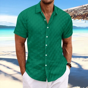 Detail of emerald green short sleeve shirt showing grid texture and contrast buttons